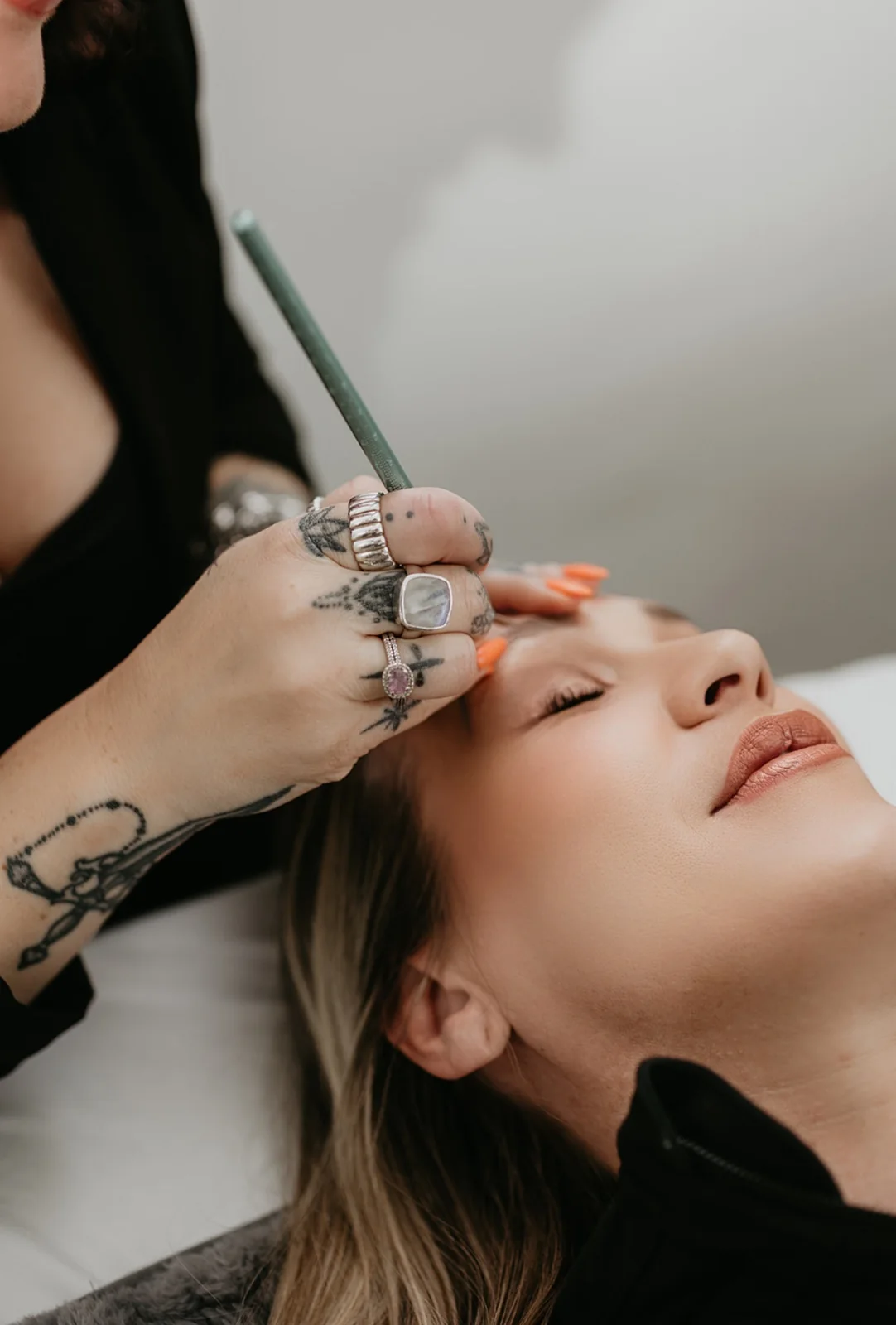 Cher holding a brow mapping pencil